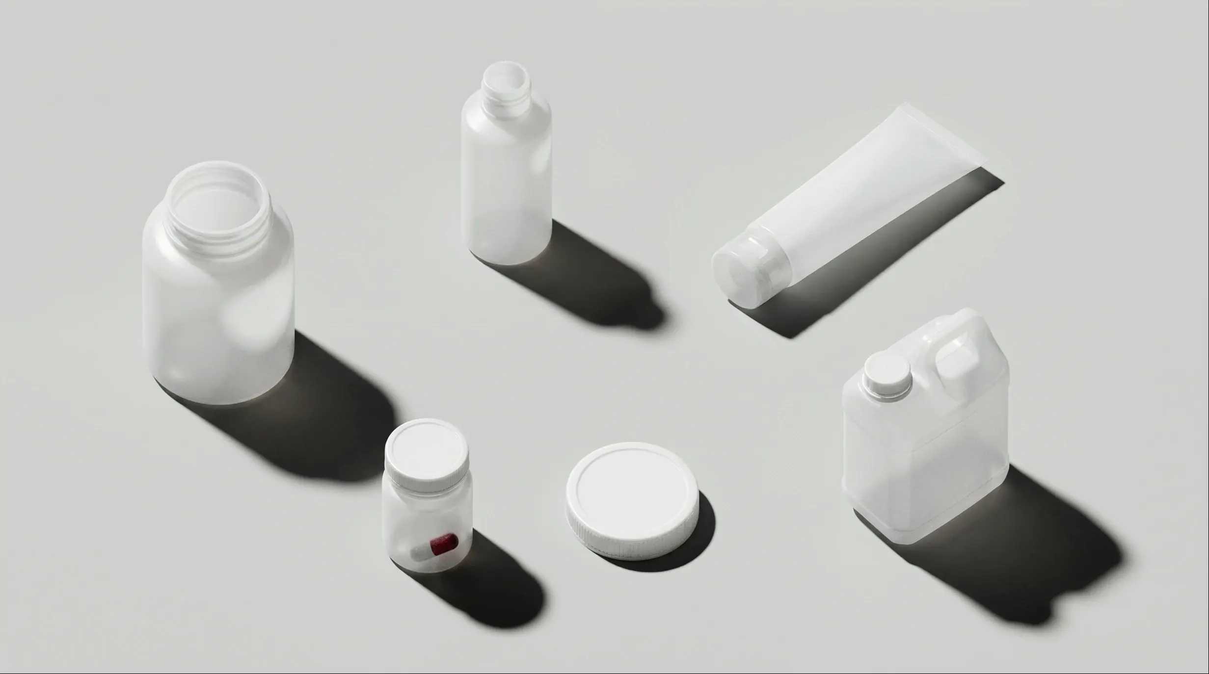 Translucent white containers seen from above, each with its cast shadow